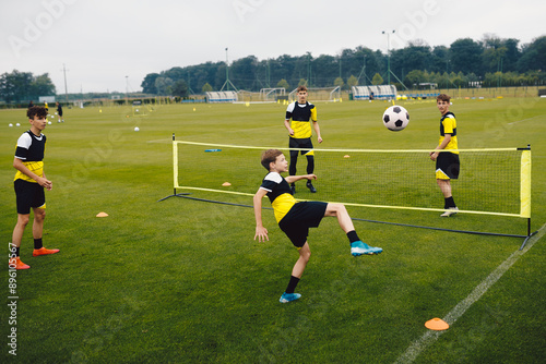 Obraz na plátně Youth soccer players playing football tennis training game