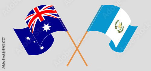 Crossed and waving flags of Australia and Republic of Guatemala