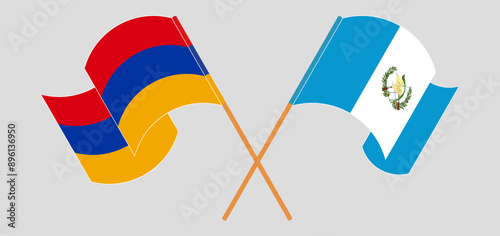 Crossed and waving flags of Armenia and Republic of Guatemala