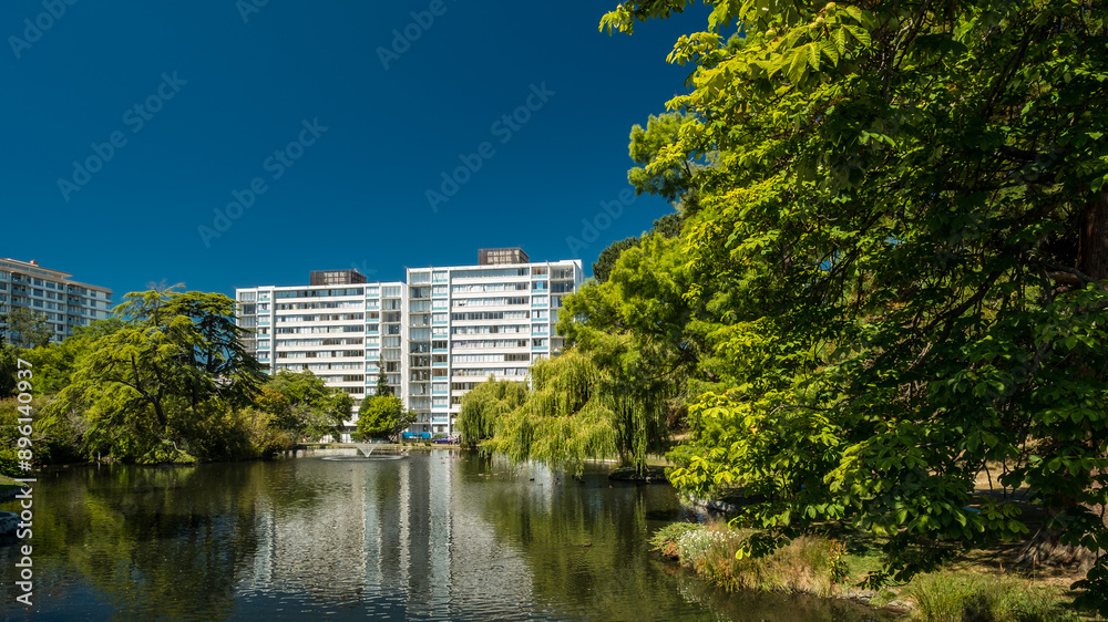 Goodacre Lake, Beacon Hill Park and mid-century modern apartment buildings, Victoria, British Columbia, Canada. Goodacre Lake, Beacon Hill Park and mid-century modern apartment buildings, Victoria, British Columbia, Canada.