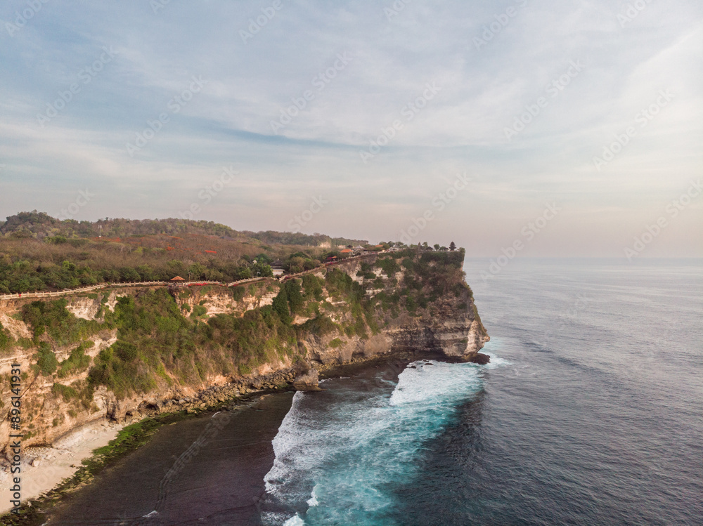 Felice Sunset Point in Bali, Indonesia. Indian Ocean and Rocks in Background Felice Sunset Point in Bali, Indonesia. Indian Ocean and Rocks in Background
