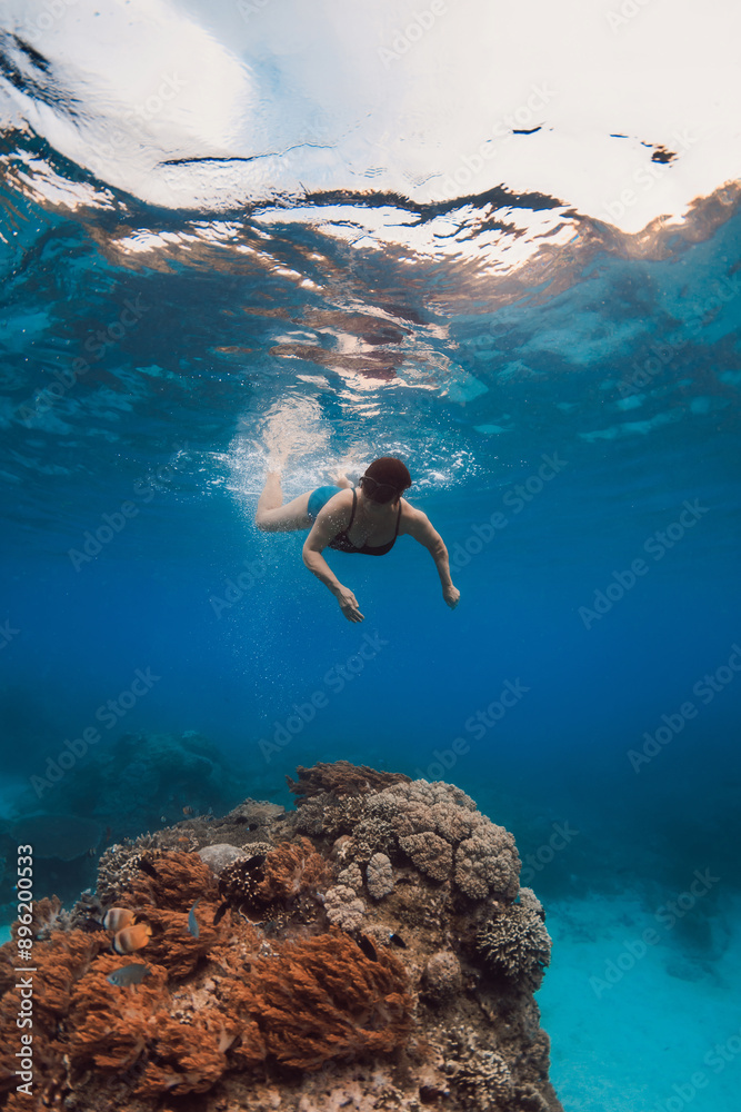 Fototapeta premium 60s woman snorkeling and diving in blue sea. Snorkeling at vacation