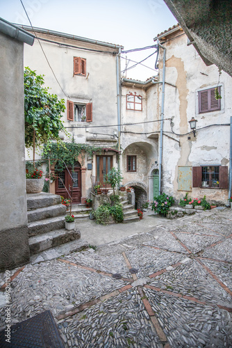 Fototapeta Naklejka Na Ścianę i Meble -  Old, historic, dreamy mountain village. Narrow streets, old houses in a romantic setting. Beautifully landscaped place with small paths and squares Mošćenice, Moscenicka Draga, Istria, Croatia