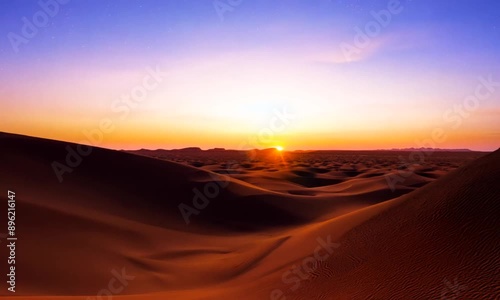 A sunset over a desert landscape. 4K Video