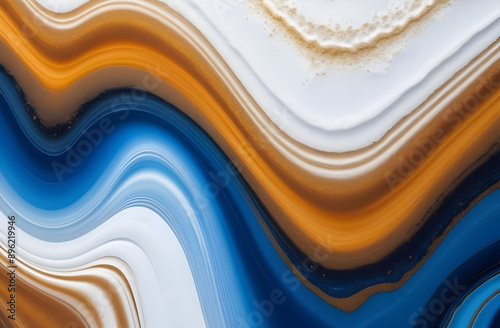 White , blue, orange and gold waves of epoxy resin. A background of smooth lines of different colors, liquid paint or resin.