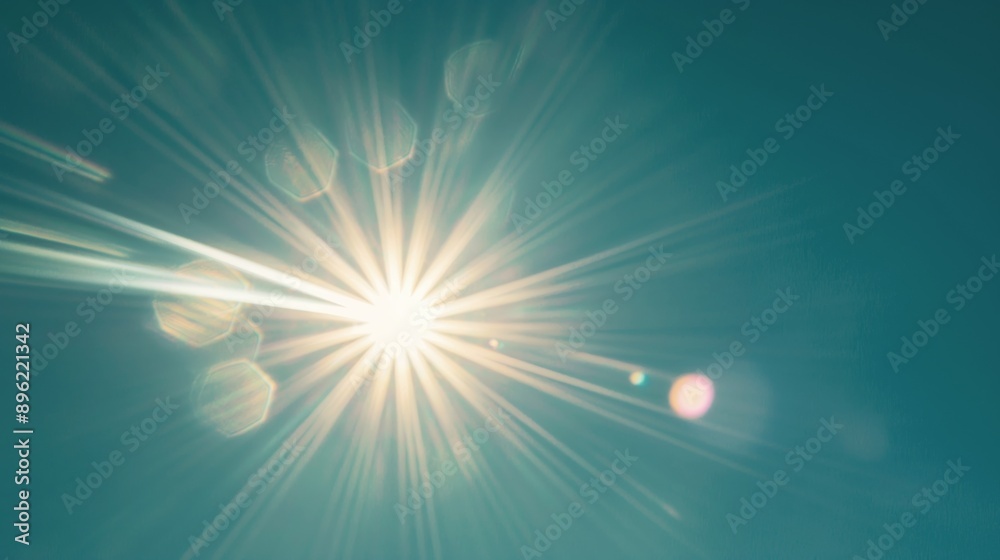 Fototapeta premium Sun Glare Rays on Blue Sky Background with Lens Flare, Isolated on Blue Background, Nature Concept for Design Element and Background.