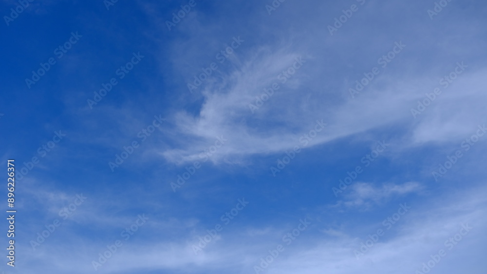 A clear blue sky adorned with soft, wispy clouds, creating a serene and calming landscape perfect for relaxation and inspiration. A clear blue sky adorned with soft, wispy clouds, creating a serene and calming landscape perfect for relaxation and inspiration.
