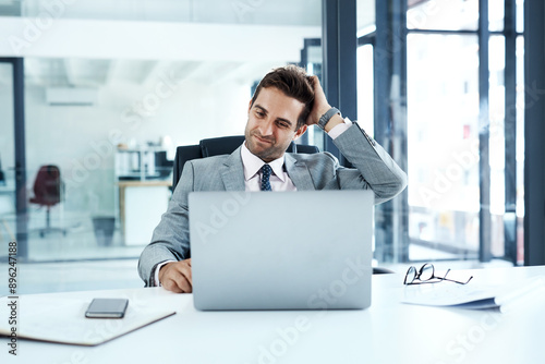 Doubt, laptop and problem solving with business man at desk in office for email, feedback or review. Accounting, budget and confused with professional employee scratching head at info on computer