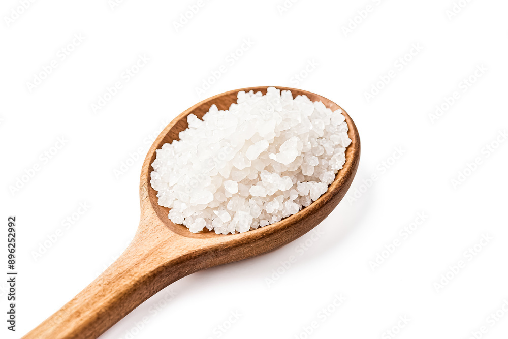Close-up of a wooden spoon filled with white salt crystals Close-up of a wooden spoon filled with white salt crystals