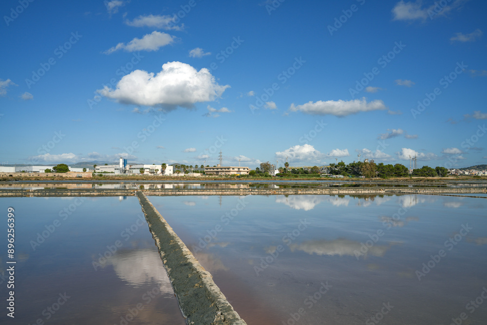 Historical salt flats in Trapani. The salt culture extraction and production in this city represents one of the major economic revenue and it is one of the oldest traditions