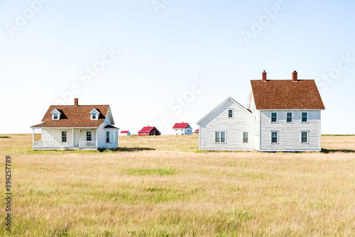 White Farmhouse in a Field of Tall Grass