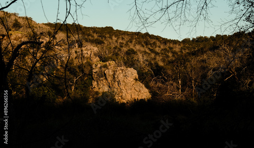 rocky cliff face in sunset golden light