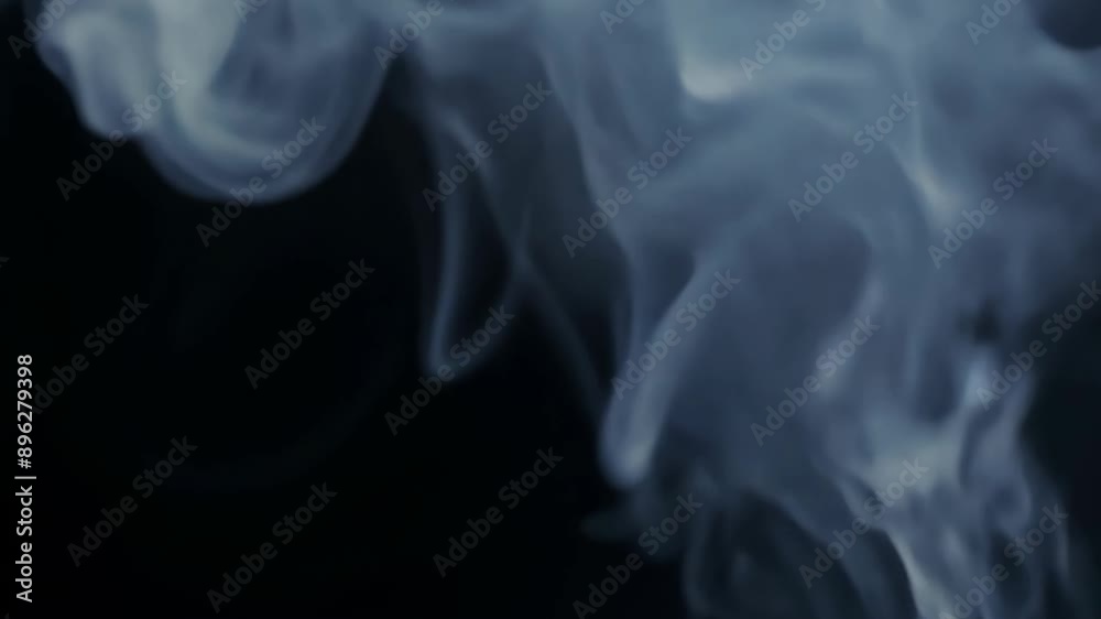 close-up of gray smoke on a black background. close-up of gray smoke on a black background.