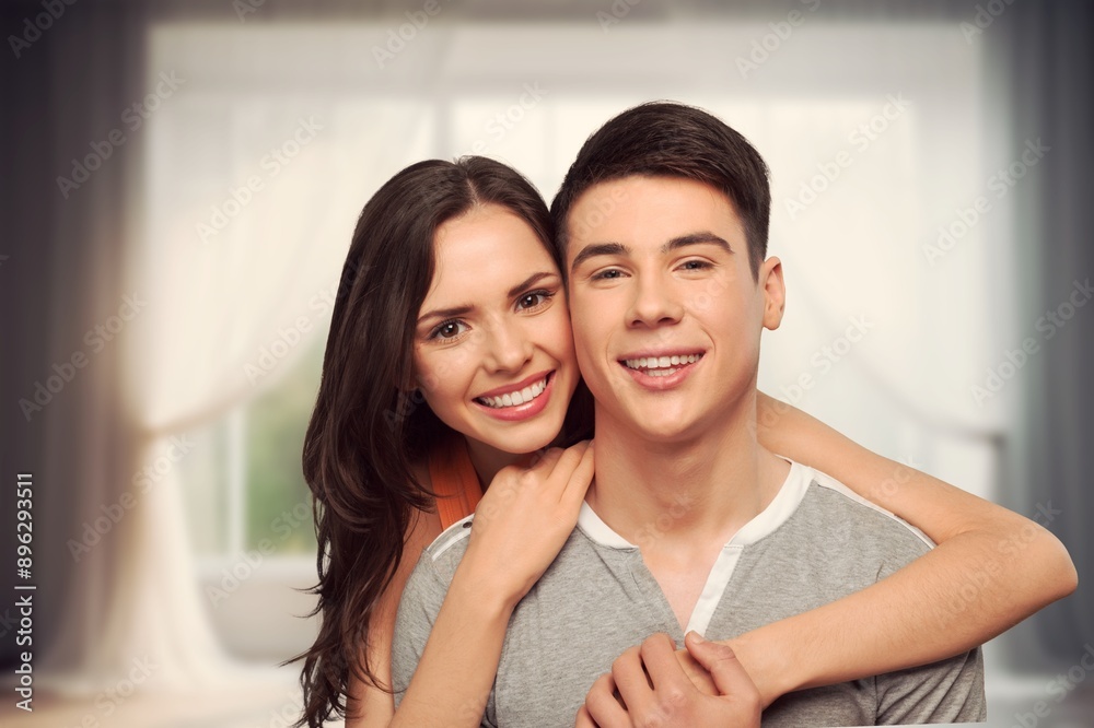 Valentine's Day concept. Young couple hugging at home. Valentine's Day concept. Young couple hugging at home.