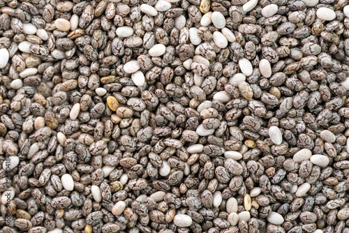 фотографія Numerous dried or dehydrated chia seeds spread evenly