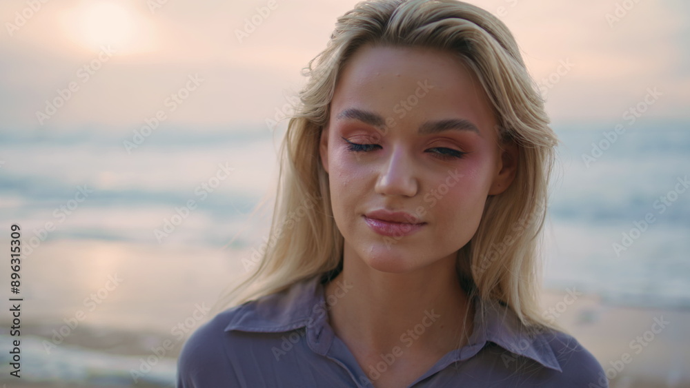 Portrait summer girl shore on beautiful evening. Smiling pretty traveler posing Portrait summer girl shore on beautiful evening. Smiling pretty traveler posing