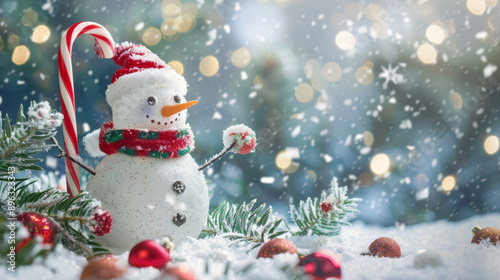 Christmas scene of a snowman with candy cane and snow