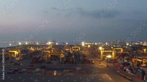 Surabaya, Indonesia  - July 22, 2024.

ariel view a trade port bustling with activity as cargo ships load and unload,  a symphony of industry in motion.