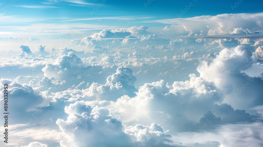 Fluffy white clouds hang high in the soft blue sky. From an airplane window, you can see the cloudscape stretching out before you. Fluffy white clouds hang high in the soft blue sky. From an airplane window, you can see the cloudscape stretching out before you.