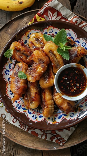 Pisang Goreng Wijen or banana fritters with sesame seed served in white plate. Indonesian food. AI generated illustration photo