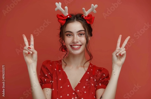 Woman in Reindeer Antlers Makes Peace Sign