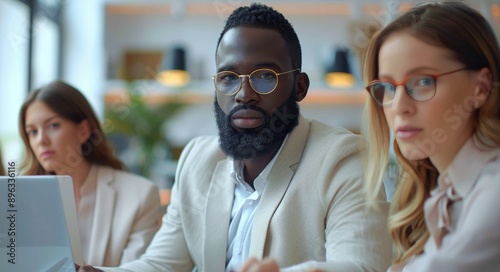 Businessman With Beard and Glasses Looking at Camera