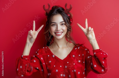 Woman in Reindeer Antlers Makes Peace Sign