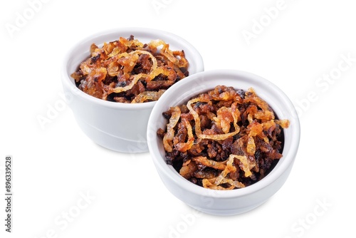 Caramelized onion in a bowl on a white isolated background