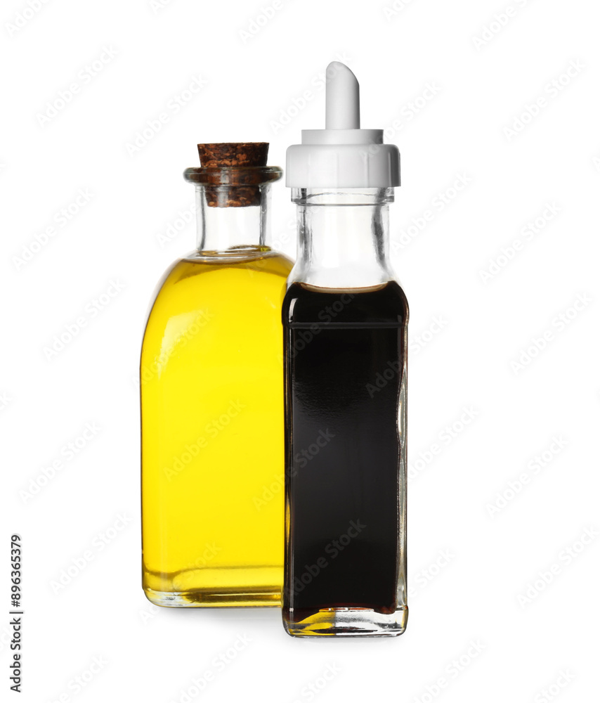 Balsamic vinegar in bottle and oil isolated on white Balsamic vinegar in bottle and oil isolated on white