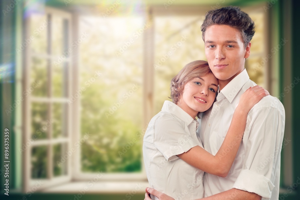 Valentine's Day concept. Young couple hugging at home. Valentine's Day concept. Young couple hugging at home.