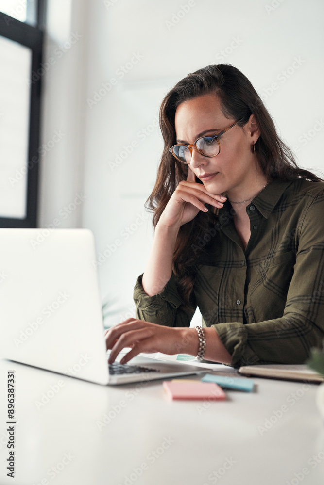 Thinking, woman and typing at desk with computer for research, email and communication. Business, technology and website developer in office for career, project and online for ideas for creativity