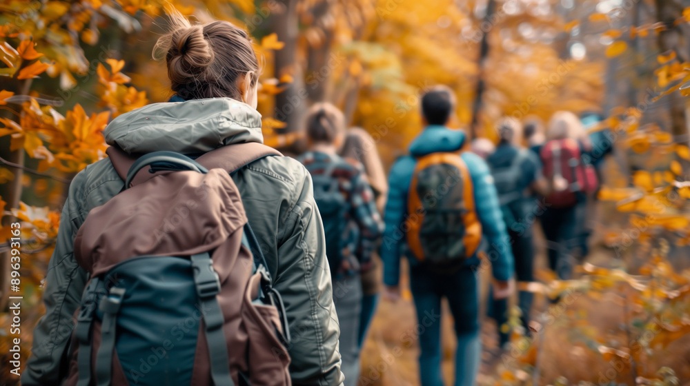 a group of people hiking in the autumn fall forest a group of people hiking in the autumn fall forest