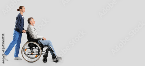Senior man in wheelchair wi...