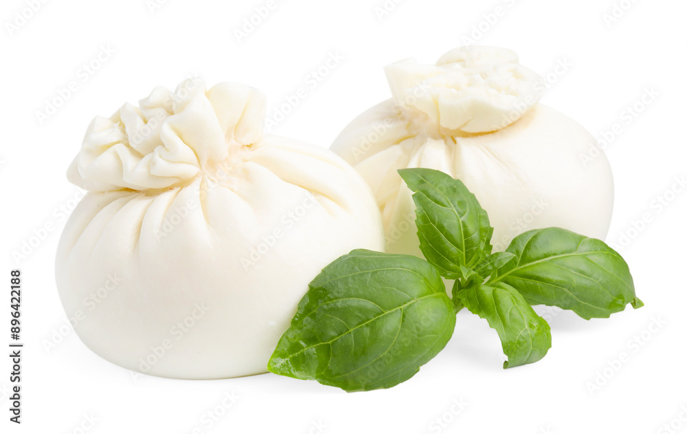 Fresh delicious burrata cheese and basil isolated on white Fresh delicious burrata cheese and basil isolated on white