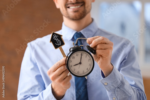 Male real estate agent hold...