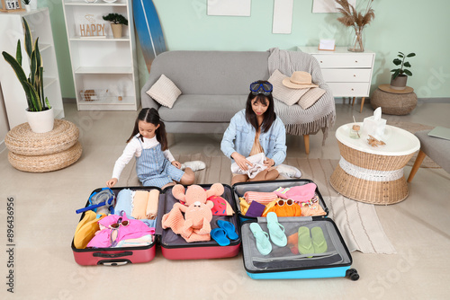 Young Asian mother and her ...