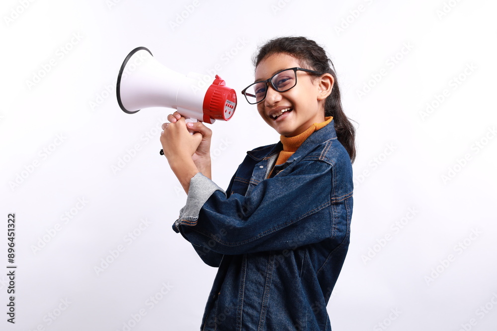Cute little girl holding megaphone in studio isolated white color background Cute little girl holding megaphone in studio isolated white color background