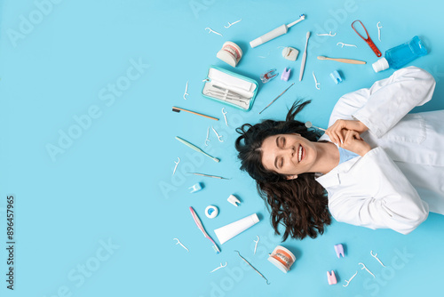 Happy female dentist lying ...