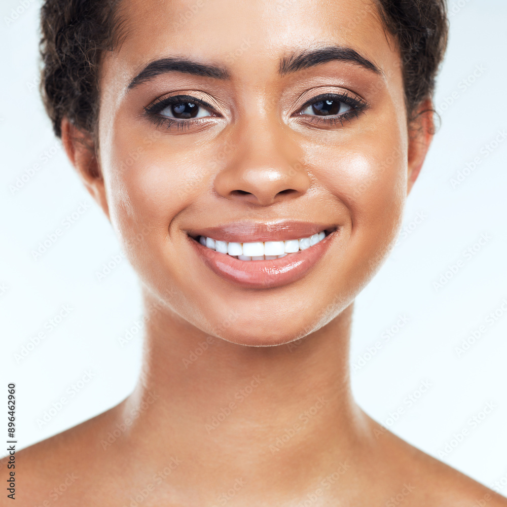 Obraz premium Happy portrait, woman and skincare for beauty with natural shine, wellness and self care in studio. Model smile, dermatology and collagen for facial, skin health and spa aesthetic by white background