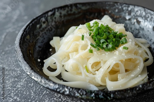 Grated radish accompanies thick white noodles photo