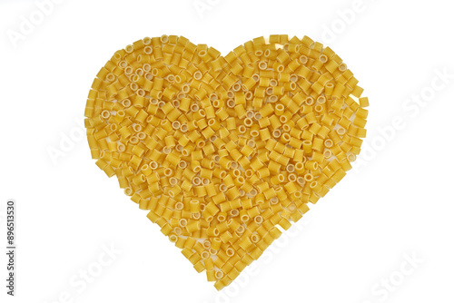 Pasta in the shape of a heart on a white background.