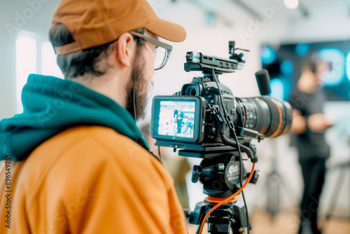 A photographer captures moments with a high-quality camera in a modern studio, showcasing creativity and professional equipment.