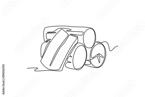 Single continuous line drawing whole healthy organic yuca cassava for plantation logo identity. Fresh woody shrub concept tropical crop icon. Dynamic one line draw graphic design vector illustration