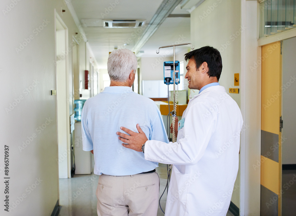 Obraz premium Hospital, walking and doctor with patient, checkup and elderly person with smile for medical appointment. Clinic, communication and consultation for wellness, care and talk for healthcare and comfort