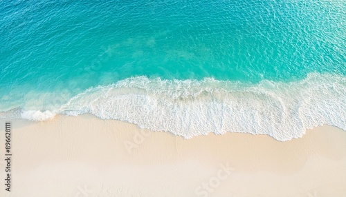 Beautiful tropical summer beach, top view of white sand and blue sea waves, nature background, vacation in paradise concept for tourism, vivid colorful.