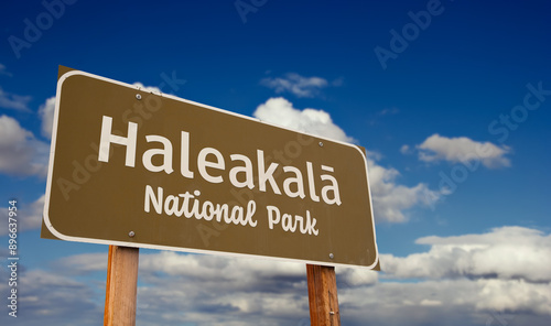 Haleakalā National Park (Hawaii) Road Sign Against Blue Sky and Clouds.