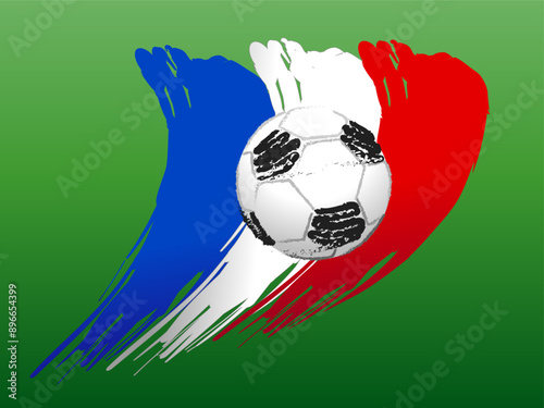 A soccer ball on the background of the French flag. Green background.