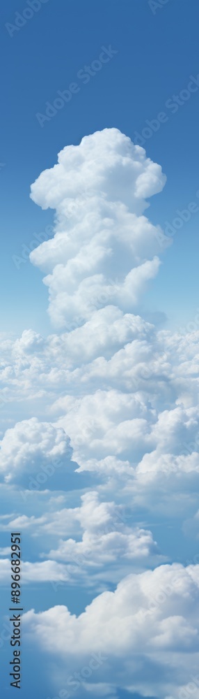 Obraz premium Vertical view of a beautiful cumulus cloud formation against a clear blue sky, capturing the serene and majestic nature of the atmosphere.