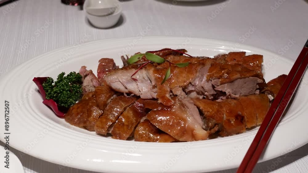 Motion of people eating roasted duck on table inside Chinese restaurant with 4k resolution.