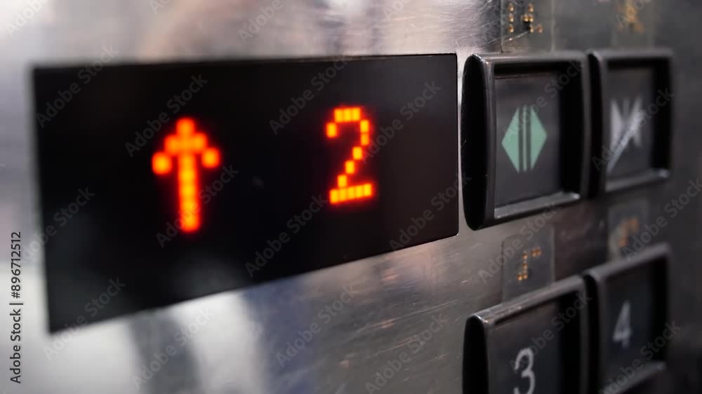 Motion of people taking the elevator from one to second floor inside a shopping mall with 4k resolution. Motion of people taking the elevator from one to second floor inside a shopping mall with 4k resolution.